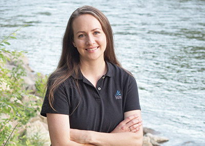 Rachel Pichelmann standing by stream