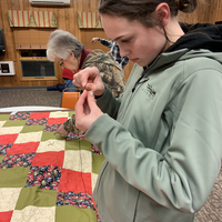 teen girl focuses on a knot