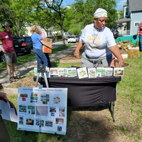 Sheronda Orridge stands behind the garden voting booth