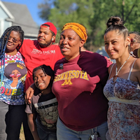 Youth surround community mentors Sheronda Orridge and Elba Negron