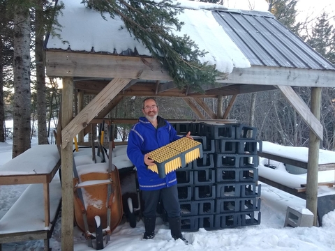 David Abazs with equipment for planting tree seedlings.