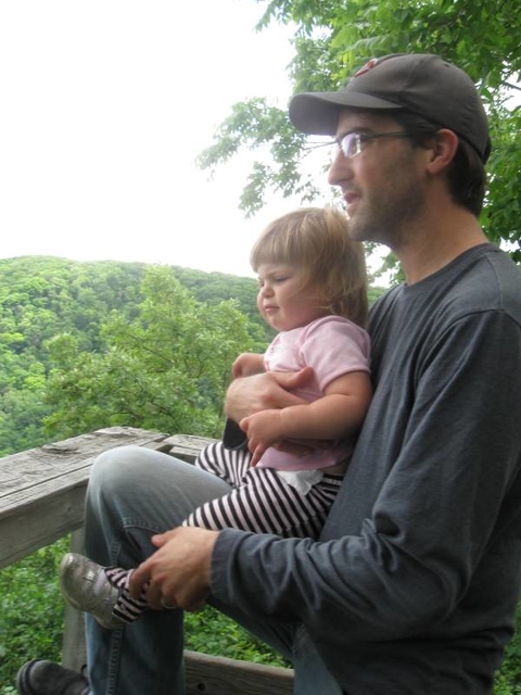 Greg Schweser holding his daughter