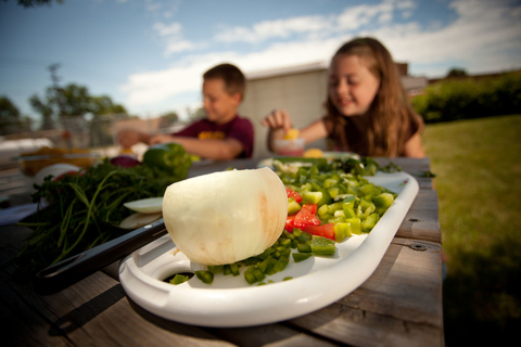 boy and girl eating veggies