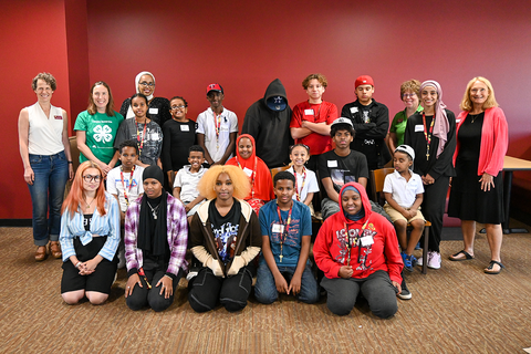 Volunteer Hanan Bawzer with a group of youth at a 4-H event in Moorhead.