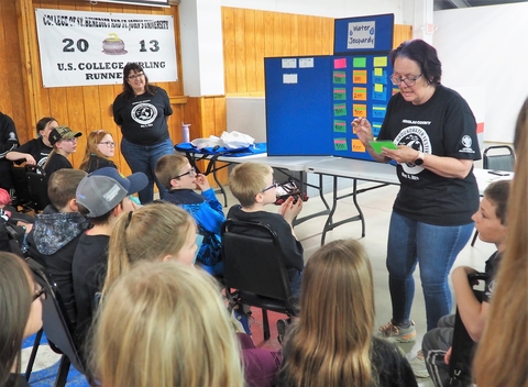 Kids prepare to answer questions for adults leading Water Jeopardy