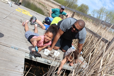 youth taking water samples