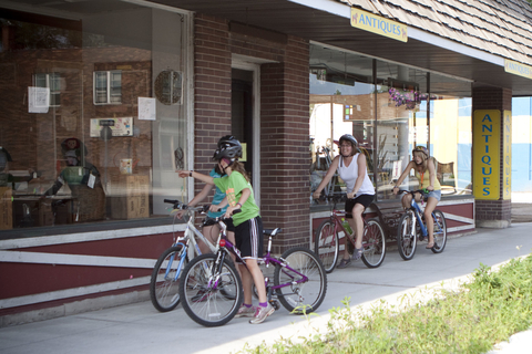 kids and woman biking