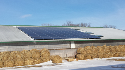 Solar panels on the roof of a barn.