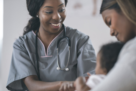 Healthcare provider with mom and newborn