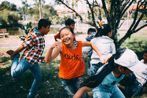 Girl running while laughing