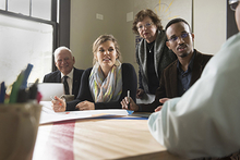 Multi-generational group in business meeting