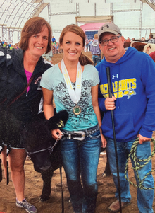 Diane Kennedy with parents and cow