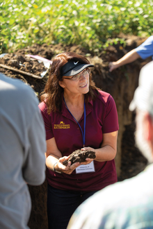  Jodi DeJong-Hughes showing soils sample to group.