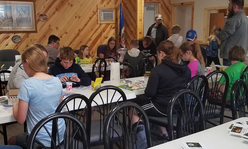 Students working at tables