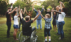 people holding hands in a circle