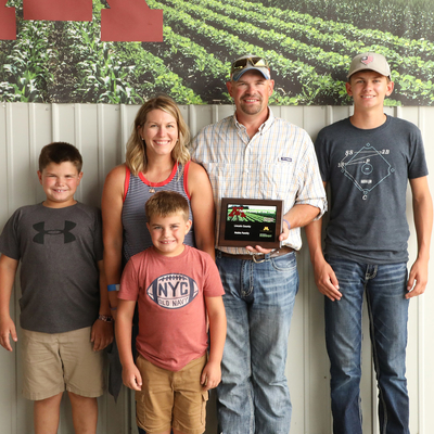 The Noble family (Chris, Jillian and three of their children) posing at Farm Fest.