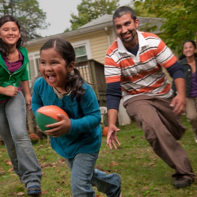 family playing in yard