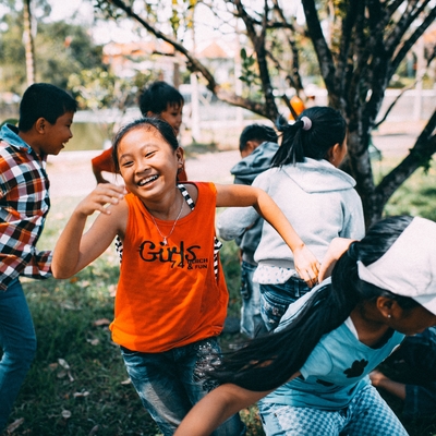 Girl running while laughing