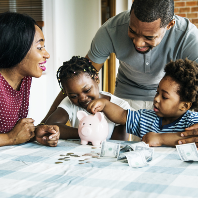 family saving money, two parents and two children