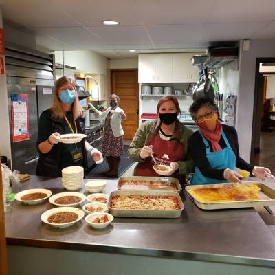 SNAP-Ed educators cook food at Vail Place. 