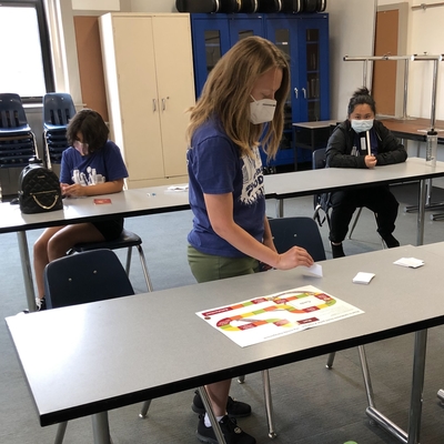 Three teenagers learning about money